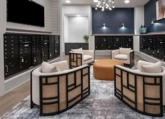 A modern living room with a grey carpet and a black and white color scheme. at Atwater at Nocatee Apartments, Florida