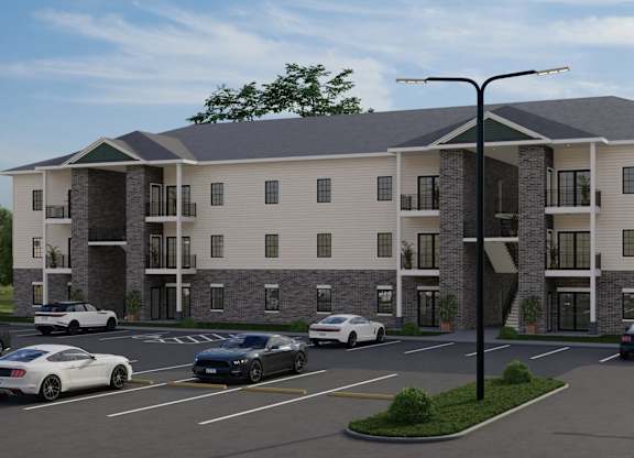 A rendering of a modern apartment complex with cars parked in the driveway.