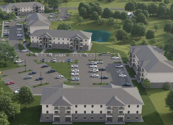 A rendering of a large building complex with a parking lot in front.