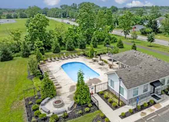 A house with a pool in the backyard.
