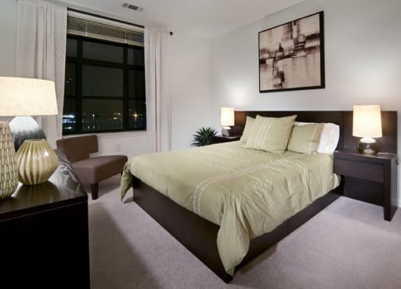 a bedroom with a large bed at The Sheffield at Englewood in Englewood, NJ