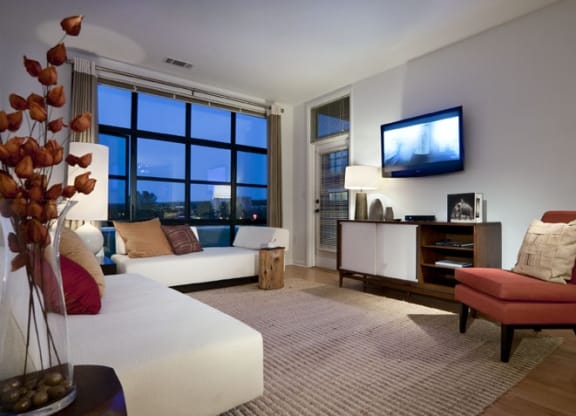 a living room filled with furniture at the Sheffield at Englewood Apartments in Englewood, NJv