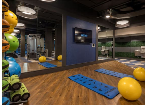 a view of the fitness center with yoga mats and exercise balls  at Shearwood Station, New Rochelle, NY