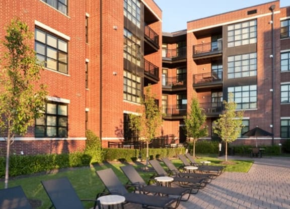Courtyard and pool deck at The Sheffield at Englewood Apartments in Englewood, NJ