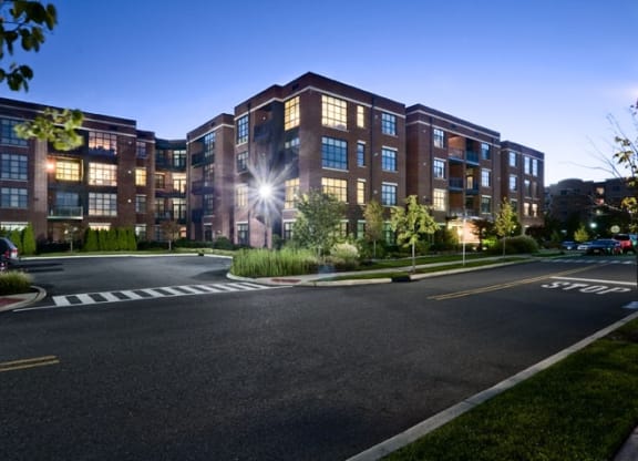 Nighttime exterior photo of the Sheffield at Englewood Apartments in New Jersey