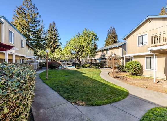 view of apartment buildings and landscaping at Redwood Landing Apartments, Novato, CA, 94947