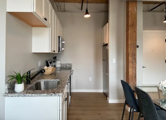 a kitchen with a counter top and a sink