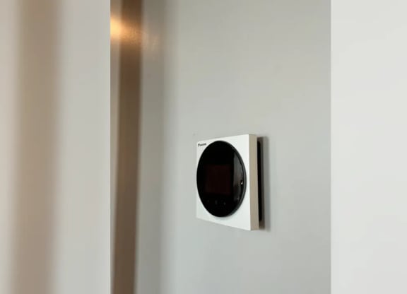 a modern light switch on a white wall