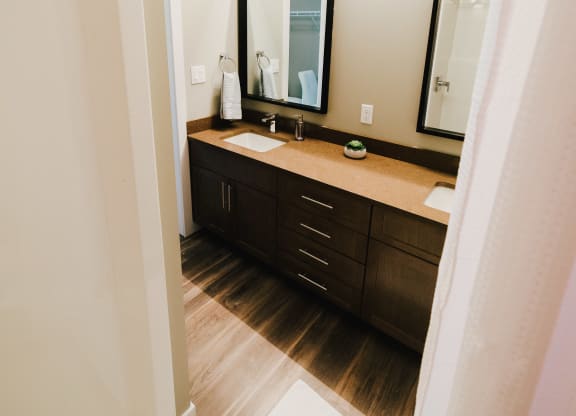 the view of a bathroom with a sink and a mirror