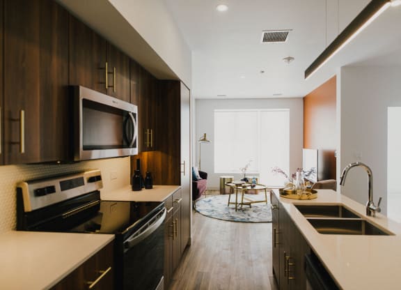 a kitchen and living room in an apartment