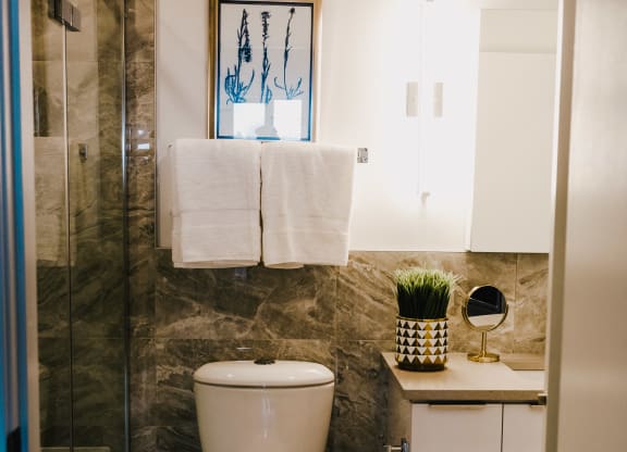 a small bathroom with a toilet and a shower