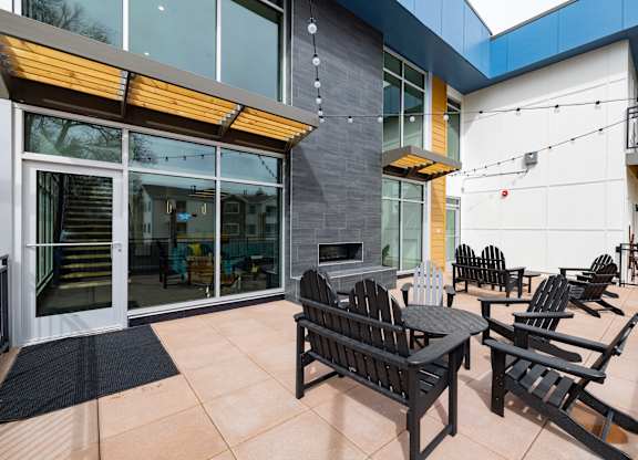 A patio with a table and chairs is shown.