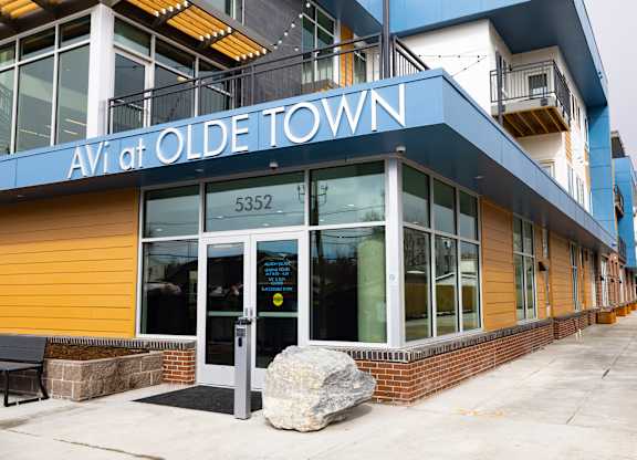 Olde Town Avi is a building with a blue and yellow exterior.