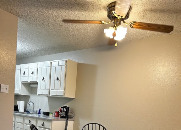 a kitchen and dining room with a table and chairs