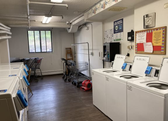 a room with appliances and a stove and a refrigerator in it