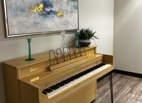 a view of a piano from the top of the stairs