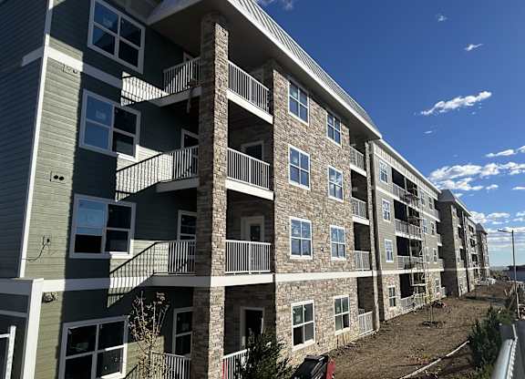 an exterior view of an apartment building with balconies