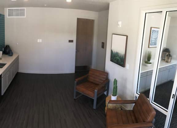 a small room with a desk and a chair