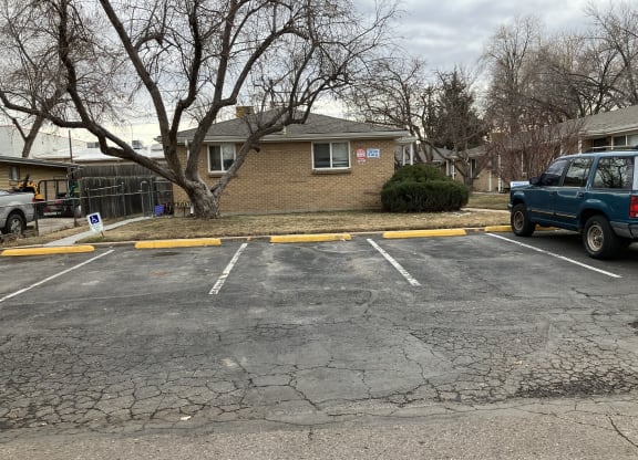 a parking lot with a blue truck parked in it