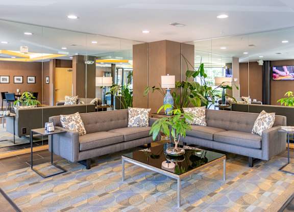 A lobby with two sofas and a coffee table.