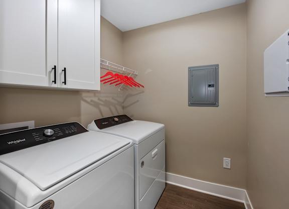 A laundry room with a washer and dryer.
