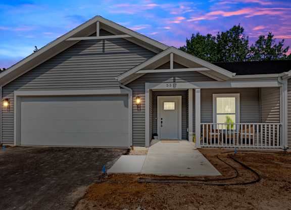 A house with a garage and a driveway.