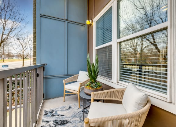 A private balcony with stylish furniture offered at Midtown 205, luxury partments, Charlotte, NC.