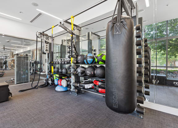 a large punching bag hangs in the corner of a gym