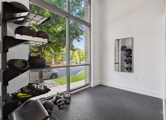 a room with a large window and white walls