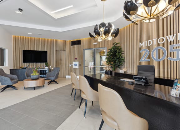 a lobby with a reception desk and chairs