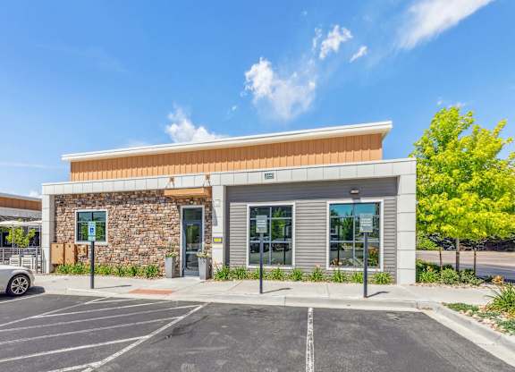 A building with a parking lot in front of it.