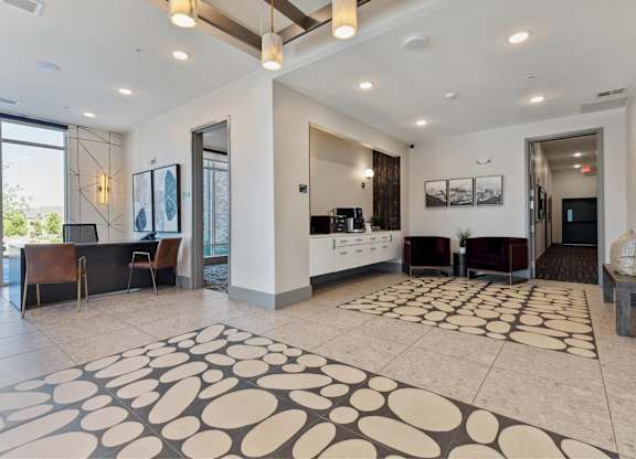 A spacious living room with a patterned rug on the floor.