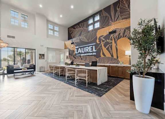 A Laurel sign is on the wall in a spacious room.