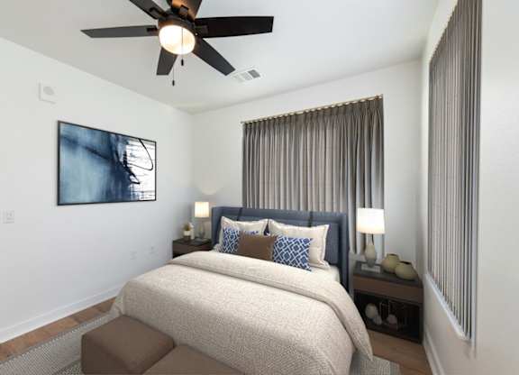 A bedroom with a bed, a ceiling fan, and a painting on the wall.