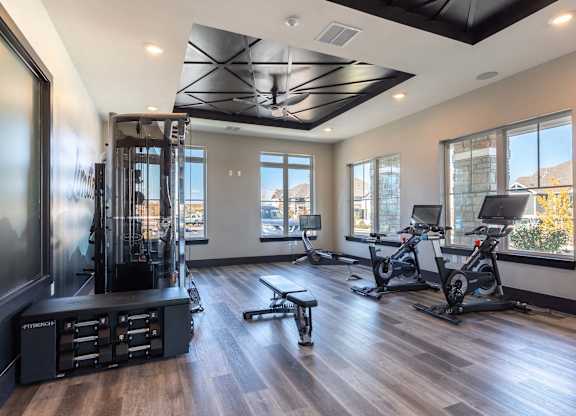A spacious home gym with a variety of exercise equipment.