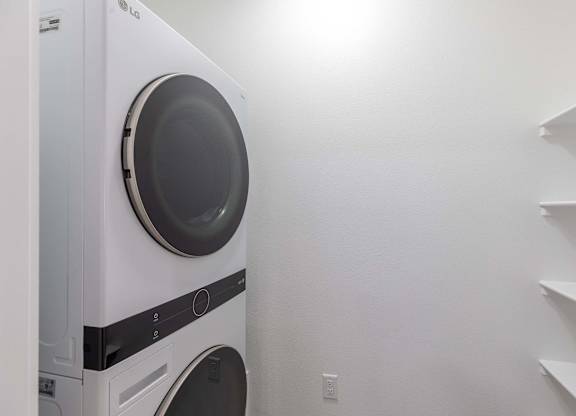 A white LG washing machine in a laundry room.