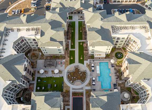 A bird's eye view of a courtyard surrounded by buildings.