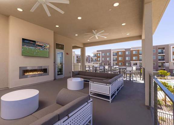 A modern living room with a fireplace and a television.