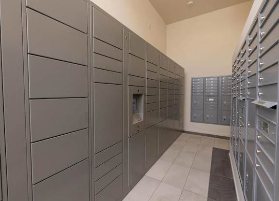 A row of grey lockers in a room.