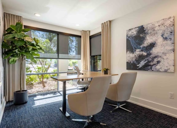 desk and chairs in conference room at slate scottsdale apartments