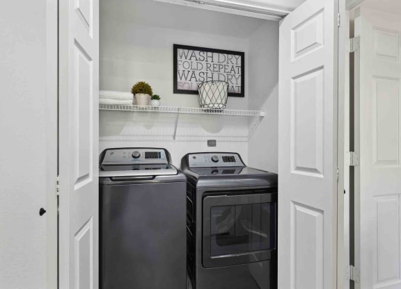a small laundry room with a washer and dryer