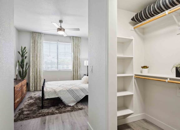 a bedroom with a bed and a bookshelf