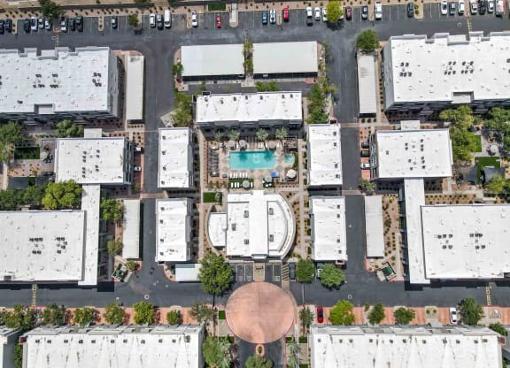 arial view of buildings with a pool in the middle