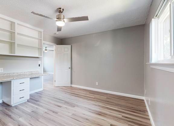 A room with a desk and a window at Pennsylvania Place, Davis, CA 95616