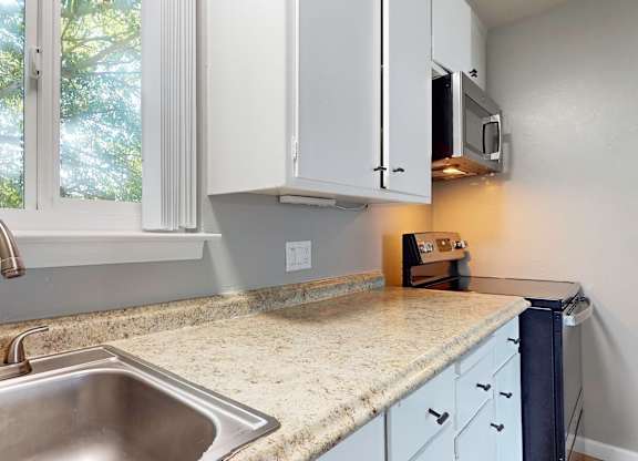 A kitchen with a sink at Pennsylvania Place, California 95616