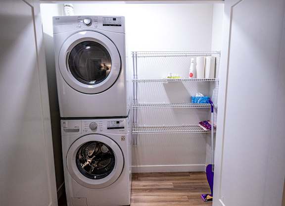 a small laundry room with a washing machine in it