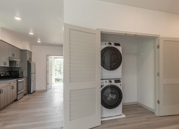 a washer and dryer in a room with a kitchen