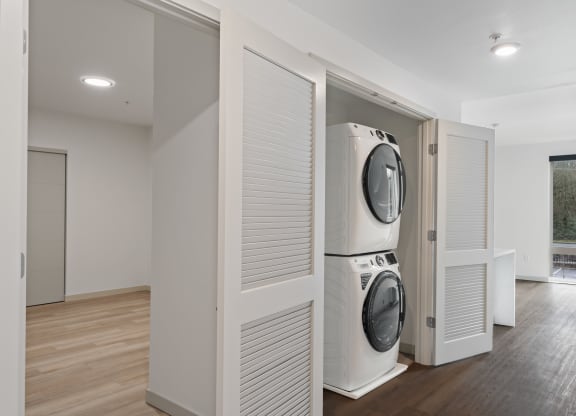 a laundry room with a washer and dryer in a closet