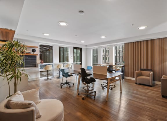 the living room has a large table with chairs and a couch