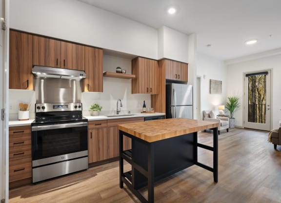 a kitchen with stainless steel appliances and a wooden table